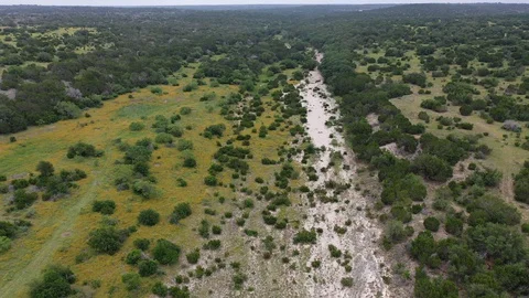 Flying over a dry creek bed in a wilderness area, Edwards County, Texas, USA Stock Footage 129205922