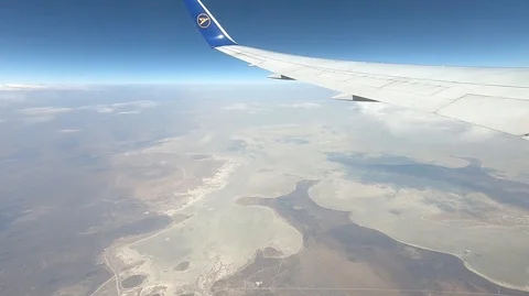 Flying over dry landscape of Namibia with Etosha pan below Stock Footage 114267566
