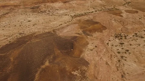 Flying over dry river beds and colored sands of Negev Desert. DJI-0210-11 Video stock 123366807