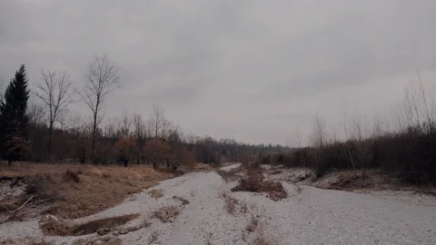 Flying Over a Dry River in Winter Rainy Day Stock Footage 86951875
