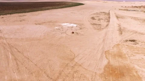 Flying over Dunes over   Desert  and showing Irrigation System for farming Stock-Footage 103303050