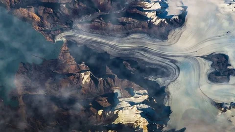 Flying over the earth on the ISS. Flying over the snow-capped mountains, aerial Stock Footage 73578631