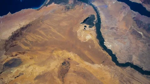 Flying over the earth on the ISS. Flying over desert, aerial view from space. Stock Footage