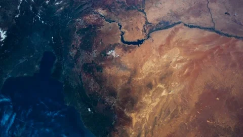 Flying over the earth on the ISS. Flying over desert, aerial view from space. Stock Footage