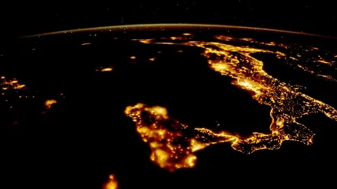 Flying over the earth's surface, shot from the space station. Flying over Italy Stock Footage 106656200