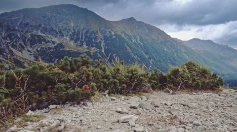 Flying over the edge of cliff to the mountain lake view, Stabilized Slow-Mo POV Stock-Footage 55872045