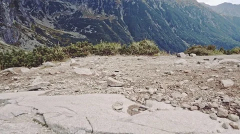 Flying over the edge of cliff to the mountain lake view, Stabilized Slow-Mo POV 스톡 동영상 55872963