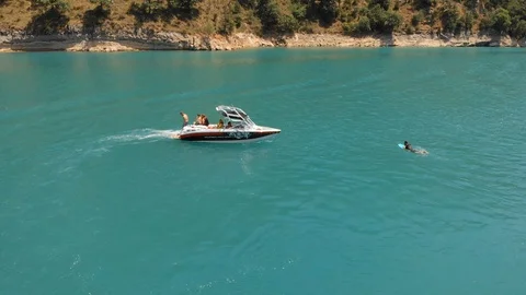 Flying over the emerald lake 4k aerial video Stock Footage 111928059