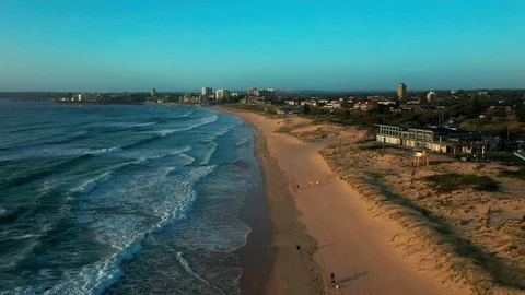 Flying over an empty beach on the northern coast of Sydney Stock Footage 102482134