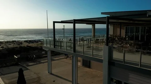 Flying over an empty beach on the northern coast of Sydney Stock Footage 102502745
