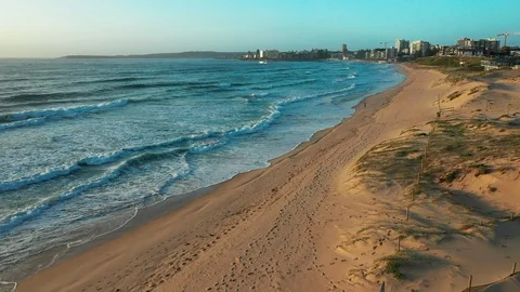 Flying over an empty beach on the northern coast of Sydney Stock Footage 102507190