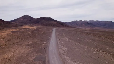 Flying Over Empty Dirt Road in Remote Jandia Desert Fuerteventura Stock Footage 309696338