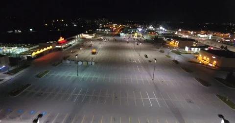 Flying Over Empty Parking Lot In Shopping Plaza At Night 002 Stock Footage 92490977