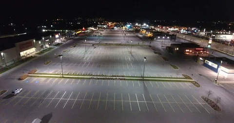 Flying Over Empty Parking Lot In Shopping Plaza At Night Stock Footage 92491030