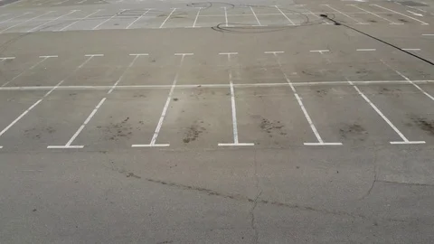 Flying over the empty parking lot during the COVID-19 pandemic Stock Footage 128282018