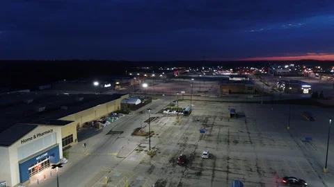 Flying Over Empty Plaza At Night With Sunset Towards Marshalls Store Stock-Footage 121653060