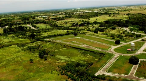 Flying over empty residential lots and roads. Video stock 27285616