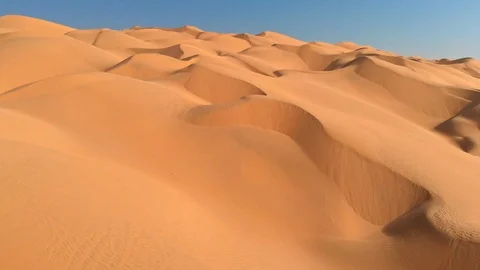 Flying over endless sand dunes in Arabian Desert. Arabian Peninsula, Oman Stock Footage 100285075