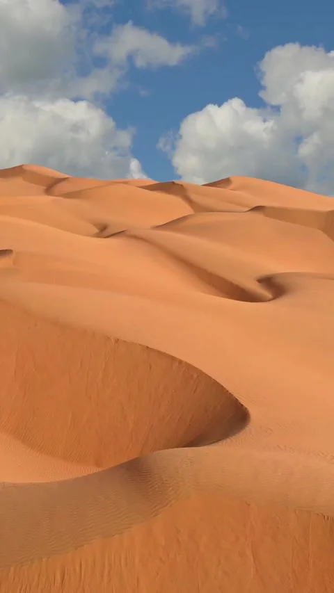 Flying over endless yellow sand dunes in desert. Sand dunes and blue sky with Video stock 280166026