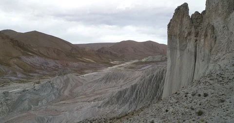 Flying over eroded mountain slope with strange water erosion formations 스톡 동영상 103495459