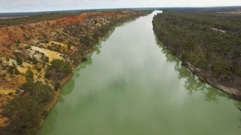 Flying over eroding sandstone shores of Murray River in Riverland, South Aust Stock Footage 93236011