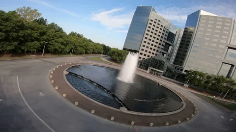 Flying over facing down city fountain High speed drone aerial flight Stockbeeldmateriaal 120792565