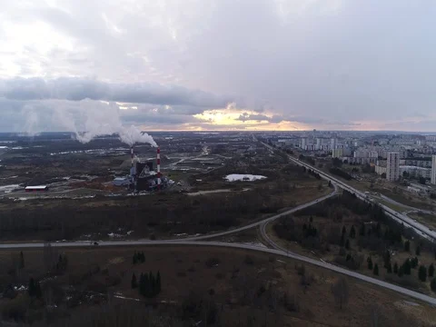 Flying over the factory, freeway at sunset. Stock Footage 73152062