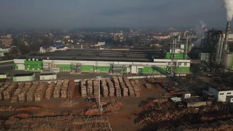 Flying over the factory for the processing of wood Stock Footage 106077108