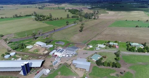Flying over a farm looking down 스톡 동영상 75430918