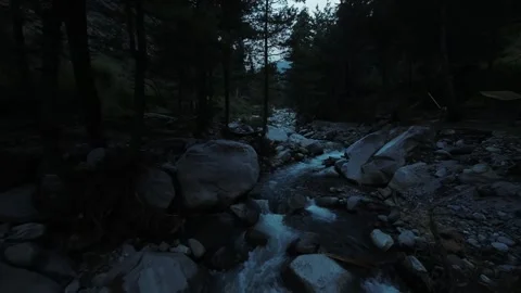 Flying over a fast river water stream upwards in Himalayas Mountains Video stock 252046815