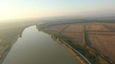 Flying over the field and the river 動画素材 38606069