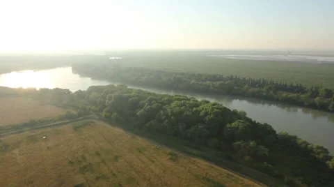 Flying over the field and the river 動画素材 38606496