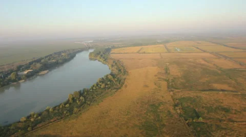 Flying over the field and the river Video stock 38606724