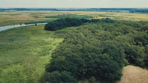 Flying over field and river Stock Footage 112305434