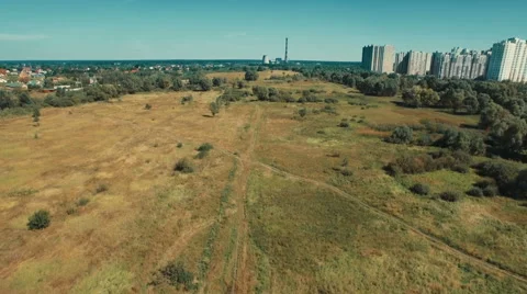 Flying Over Field in Direction of Power Station Stock Footage 68721575