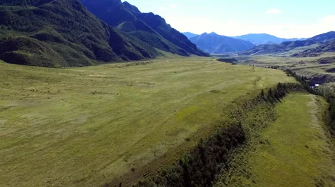 Flying over a field in the mountains Stock-Footage 67835085