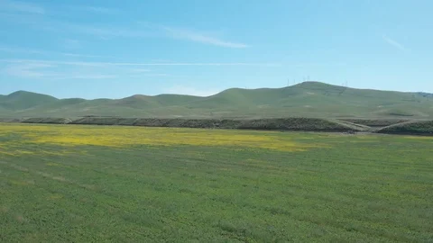 Flying Over Field To Rolling Mountains Stock Footage 89797083