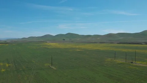Flying Over Field To Rolling Mountains Stock Footage 89798206