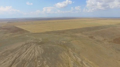 Flying over fields after harvest and uncultivated fields, aerial video Stock Footage 114288465