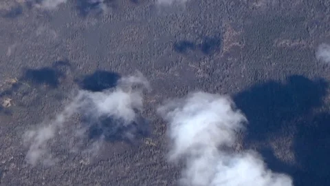 Flying over the fields, forests and clouds Stock Footage 79922534