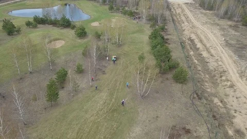 Flying over filed and working people Stock Footage 92118855