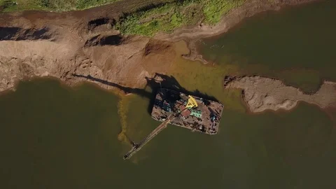 Flying over floating crane near river coast, 4k Stock Footage 78377034