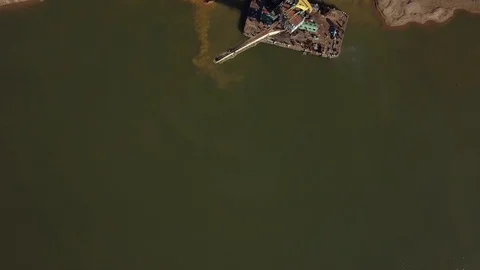 Flying over floating crane near river coast, 4k Stock Footage 78377464