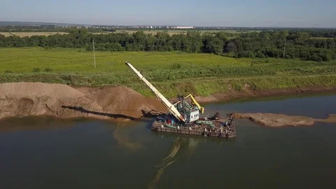 Flying over floating crane near river coast, 4k Stock Footage 78377939