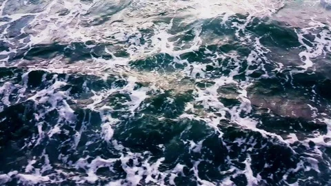 Flying over foamy waves Stock-Footage 78976883