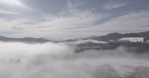 Flying over fog, forest, snow, winter, drone, switzerland 4 Stock Footage