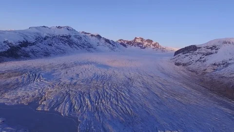 Flying over at the foot of the active glacier in Skaftaf Stock Footage 82868871