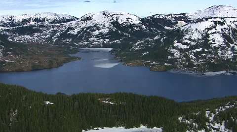 Flying over forest and lake in Alaska Stock Footage 62284271