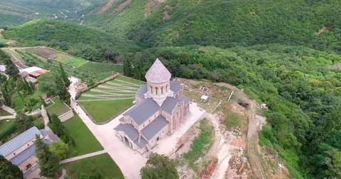 Flying over forest and mountain church Video stock 75314788