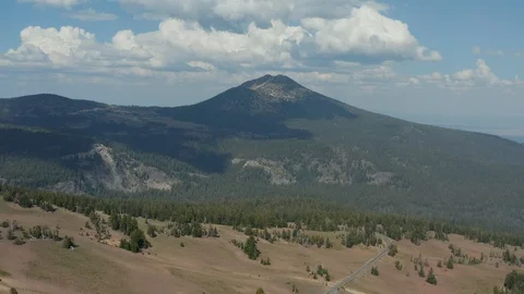 Flying over a forest and towards a mountain near Crater Lake National Park Stock Footage 120575949